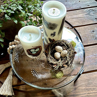 Glass serving stand with croissant and cheese