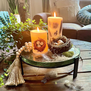 Round glass display stand holding cheese slice