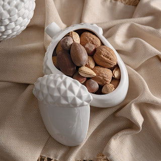 White porcelain acorn-shaped container