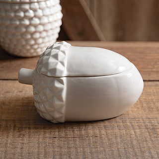 Single acorn-shaped porcelain container with lid closed
