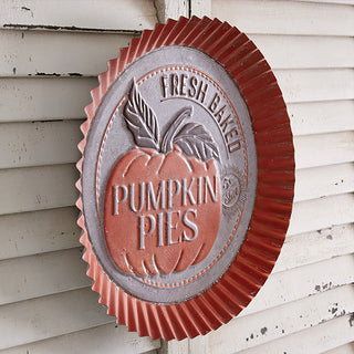 Side view of rustic metal pumpkin pie wall sign with ridged edge, farmhouse fall decor