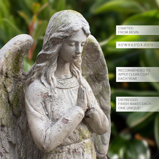 Close-up of resin angel statue with moss-like finish, praying hands and product details for outdoor garden décor