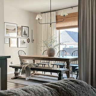 Farmhouse dining room with rustic black chandelier lighting