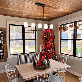 Farmhouse dining chandelier over wood table Christmas decor