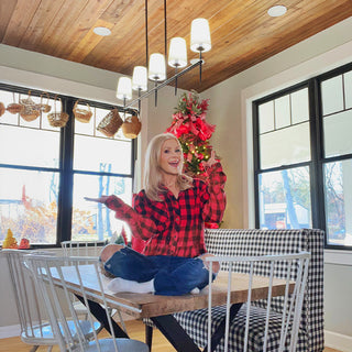 Rustic dining room chandelier over table holiday styling