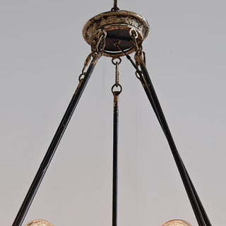 Distressed canopy detail of rustic chandelier lighting