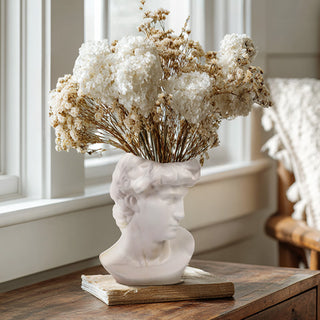 Decorative bust head vase with dried hydrangeas