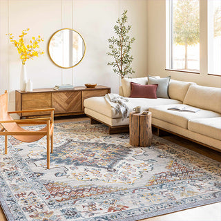 Living room with beige sectional sofa, wooden coffee table, and decorative rug.