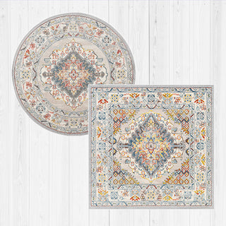 Round and square area rugs with intricate patterns on a light wooden floor.