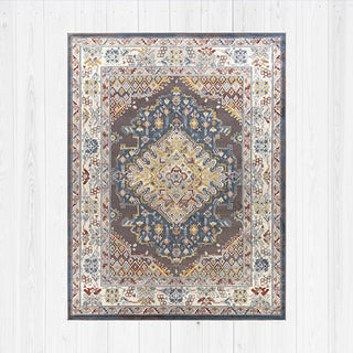 Decorative area rug with intricate pattern on a light wooden floor