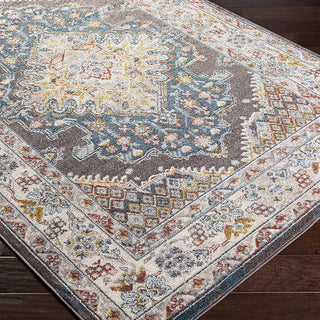 Decorative rug with intricate patterns on a wooden floor