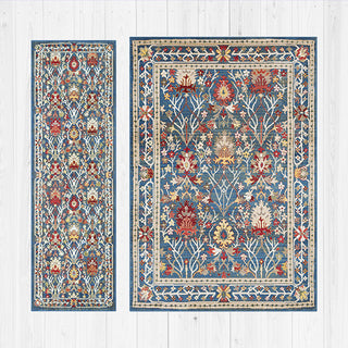 Two floral-patterned rugs on a white wooden floor.