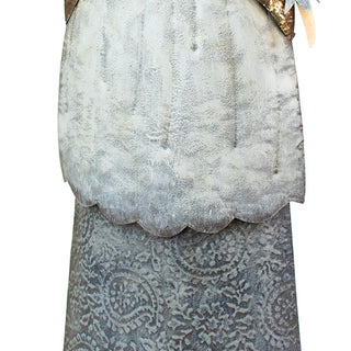 Detailed view of the painted metal angel’s textured dress with distressed gray and white finish for seasonal décor.