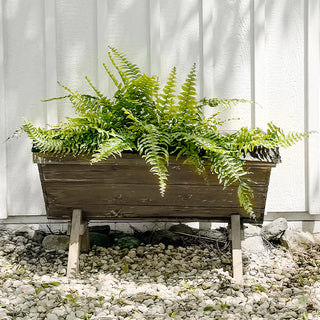 Rustic reclaimed-wood planter box outdoors