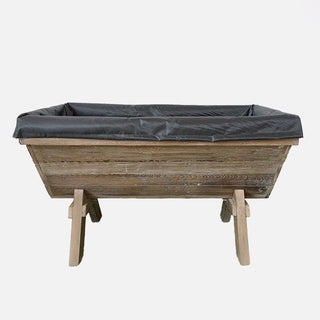 Reclaimed-wood outdoor planter box with black plastic liner