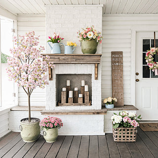 Farmhouse porch decor with distressed green metal planters