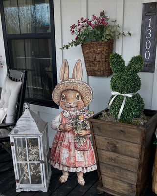 bunny sign with bunny topiary in wood planter easter decor and spring decor on front porch