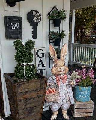 bunny sign with bunny topiary in wood planter easter decor and spring decor on front porch