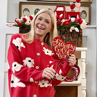Woman holding Valentine heart garden stake home decor