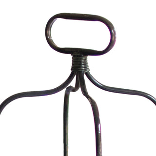 Close-up of metal handle on three-tier galvanized serving stand