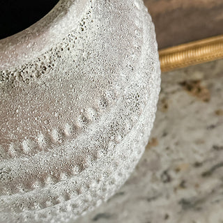 Close-up of distressed textured ceramic vase surface detail