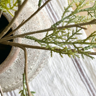 Top view ceramic vase opening with faux greenery stems