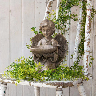  Angel garden statue with wings holding bowl planter on rustic white table