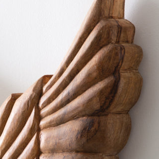 Rustic wood wing sculpture side detail view