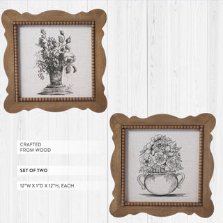 Two wooden-framed prints of floral illustrations on a white background