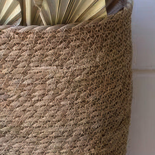  Detail shot of seagrass wall basket edge showing tight woven texture and natural tan finish