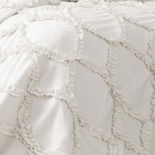 Detailed texture shot of diamond-pattern ruffle ribbon embroidery on white polyester comforter