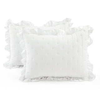 Pair of white ruffle pillow shams with embroidered details and frilled edges