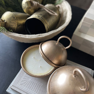 Brass cloche candle on coffee table decor