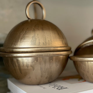 Distressed brass cloche candle close up finish