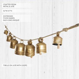Seven vintage brass bells on jute rope showing distressed finish details
