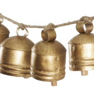Close-up of hand-knotted jute loops and aged metal bell patina