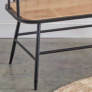 Black powder-coated metal frame legs with H-bar support structure on bamboo wood dining bench for stability