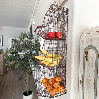 Three-tier fruit basket hanging in hallway decor
