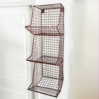 Empty three-tier distressed metal wall storage basket