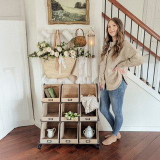 Rustic rolling wood cubby storage organizer in entryway