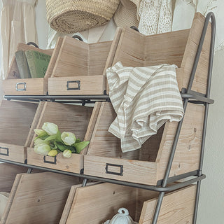 Close-up wooden cubby shelves with metal frame accents