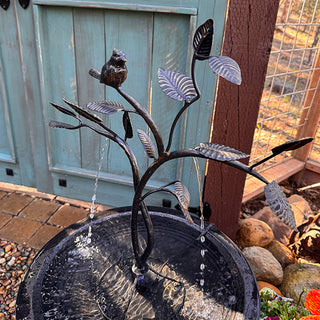 Handcrafted iron bird bath fountain with leaf details