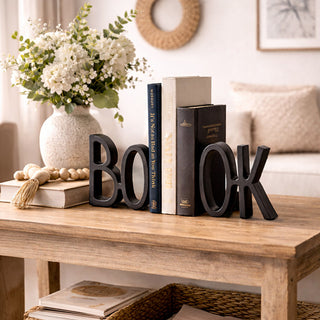 Black bookend decor on rustic coffee table