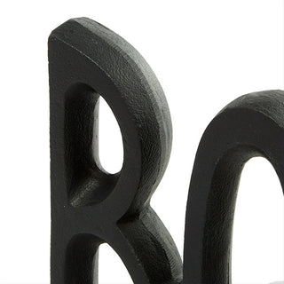 Textured matte black aluminum bookend close-up