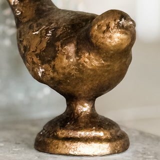 Detailed view of textured gold bird figurine