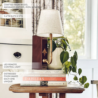 Distressed wood accent lamp styled on side table