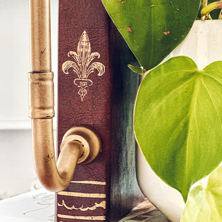 Close-up rustic lamp with vintage fleur-de-lis detail