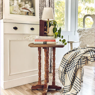 Rustic bedside table lamp in cozy cottage interior