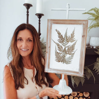 Woman holding framed pressed fern farmhouse decor