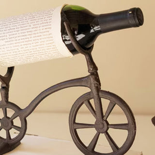 Rustic cast iron bike wine holder detail shot showing handlebar cradle
